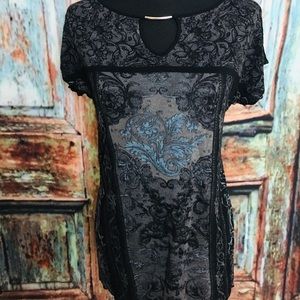 Fun short sleeved tunic with metal detail